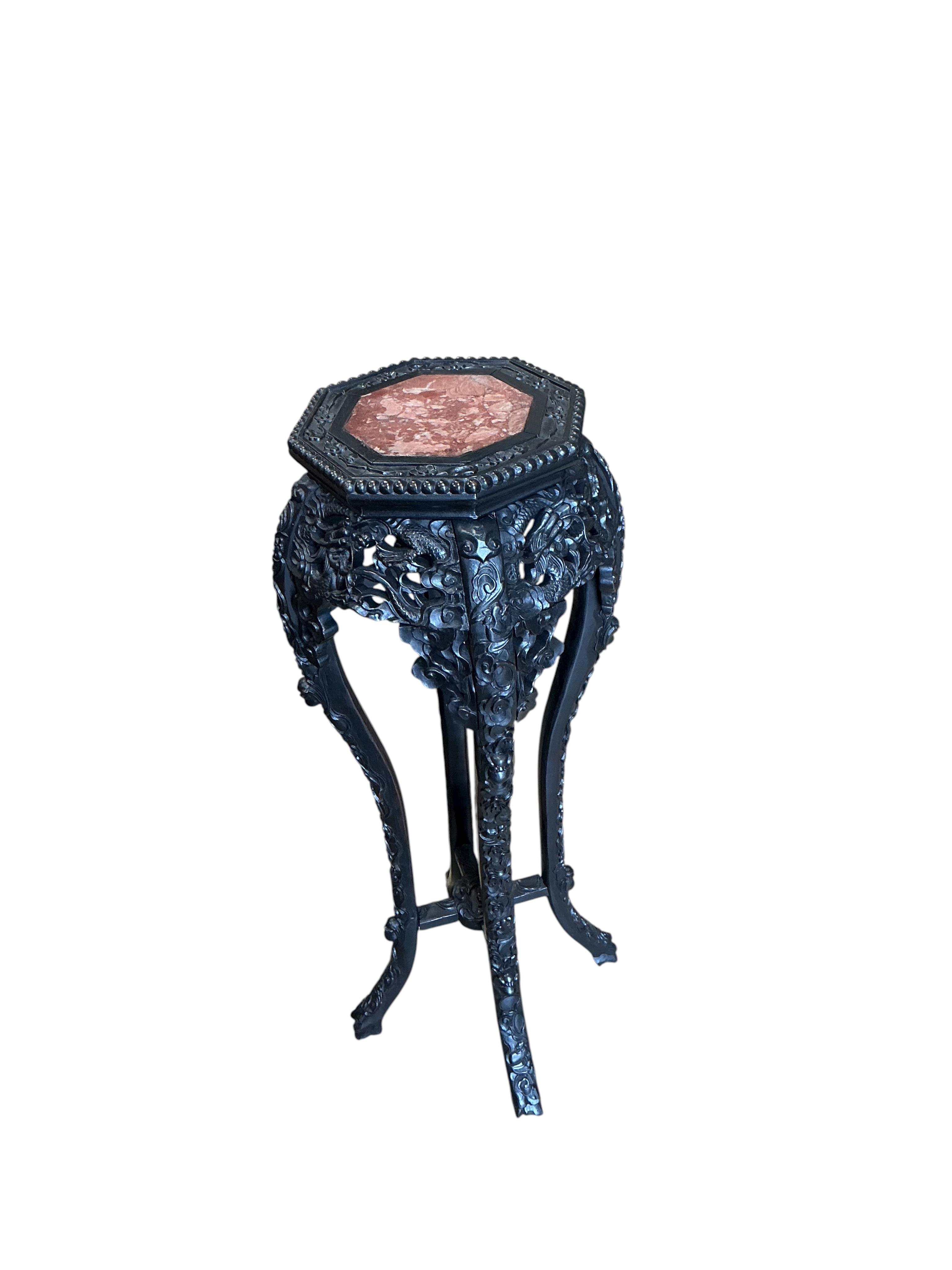 A Chinese octagonal marble topped vase stand, width 32cm, height 91cm